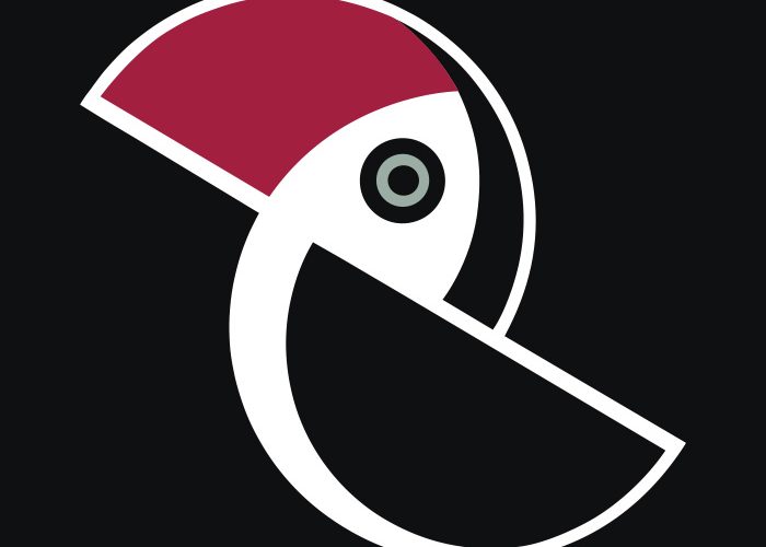 Godło PPA: stylizowany czarno-biało-czerwony tukan na czarnym tle